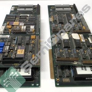 Two vintage green printed circuit boards laid side by side on a white surface, showing dense DIP chips, connectors, and blue plug components at one end.