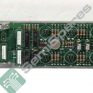 Long green circuit board populated with resistors, ICs, connectors, and edge ports at both ends, typical of vintage computer hardware.