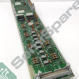 Long green circuit board densely populated with resistors, capacitors, ICs, and a large edge connector at one end (electronic control module).