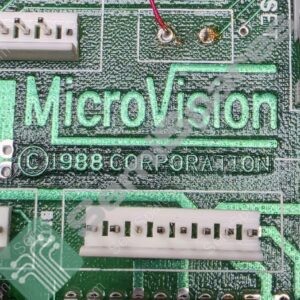 Close-up of a green printed circuit board with a white edge connector, solder joints, and the word 'Microvision' printed in bright green.