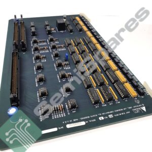 Circuit board with numerous integrated circuits, gold edge connectors, and a blue capacitor near the corner, viewed at an angle.