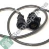 Close-up of a black circular multi-pin electrical connector with a gray cable
