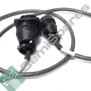 Coiled black electrical cable with two large black circular connectors attached at a joint.