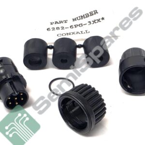 Close-up of black circular multi-pin electrical connectors with gold pins.