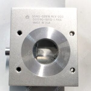 Close-up of a machined metal block with engraved numbers and 'MADE IN USA' visible on the surface.