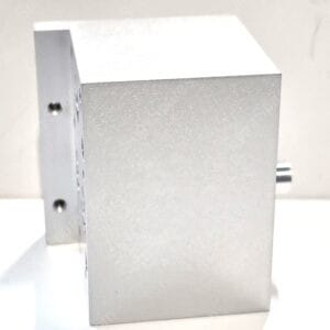 Angled view of a gray metal cabinet or box with visible screws along the left edge and a speckled finish.
