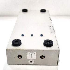 White metal control panel with several circular ports and knobs, photographed from a top-front angle.