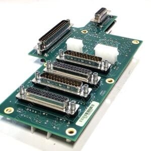 Green circuit board with several DB-style connectors mounted along its edge, photographed at an angle.