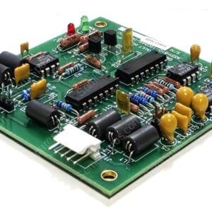 Close-up of a green printed circuit board with resistors, capacitors, ICs, and connectors visible on a white background.