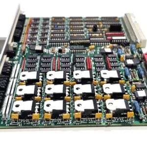 Dense circuit board populated with numerous DIP ICs, capacitors, and a red edge connector.