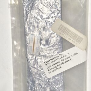 Foil-wrapped rectangular sample inside a clear plastic bag with a barcode label attached.