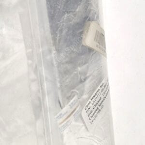 Plastic bag containing a wrapped gray rectangular object with a barcode label stuck to it.