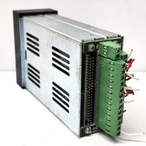 Close-up of a metal industrial control module with a green terminal block and bundled wires.