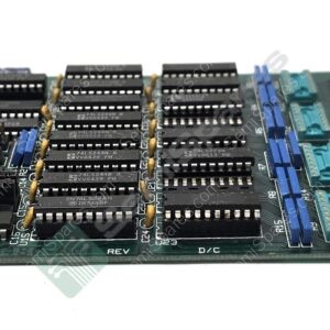 Printed circuit board densely populated with DIP integrated circuits, edge connector, and blue expansion slots viewed from the side, vintage computer hardware