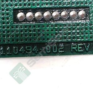 Close-up of a green PCB edge showing two rows of silver pins and connector footprints, labeled WB 110494-002 REV C.