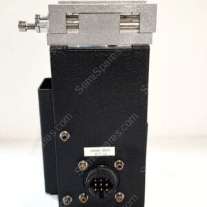Close-up of a metal clamp mounted on a black base with a circular multi-pin connector at the bottom surface.