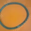 Blue circular abrasive sanding ring laid flat on an orange surface.