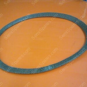 Teal circular sanding belt laid flat on an orange surface, showing a rough texture around the ring.