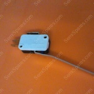 Blue miniature microswitch with attached gray wire on an orange surface, viewed from the side.