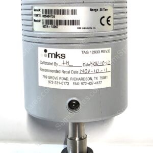 Industrial force transducer cylinder labeled MKS, range 20 ton, mounted on a shaft with fittings and a brown top cap.