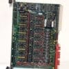 Green circuit board labeled Applied Materials Digital I/O Board, densely populated with DIP ICs, orange capacitors, and edge connectors at top and bottom