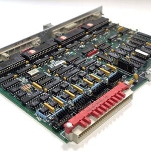 Printed circuit board with numerous DIP ICs, edge connectors, and yellow capacitors. Used in electronic equipment.