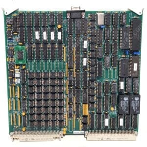 Vintage computer expansion board densely populated with DIP ICs and gold edge connectors at bottom.