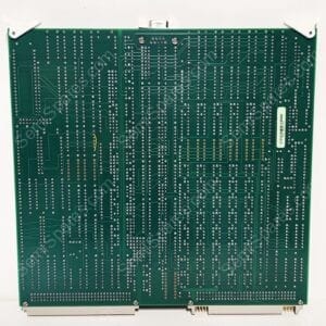 Back side of a green printed circuit board with dense copper traces and numerous silver solder vias and edge connectors