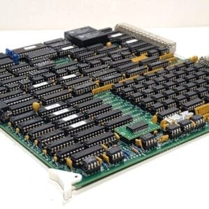 Dense green circuit board packed with many black DIP integrated circuits and gold capacitors