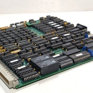 Dense vintage computer motherboard with hundreds of DIP ICs, edge connectors, and yellow capacitors on a green circuit board.