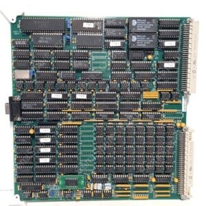 Green vintage circuit board densely packed with DIP ICs, connectors, and yellow capacitors; edge connector on the right side.