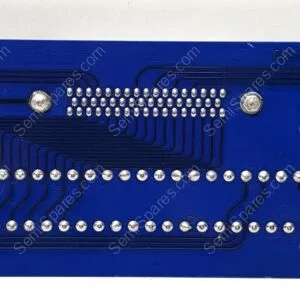 Blue PCB with dense rows of soldered pins along the bottom, silver joints and routed black traces forming curved patterns, likely an old connector plate.