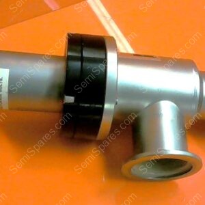 Metal industrial valve fitting with a side outlet, shown on an orange surface on the left side of the image.