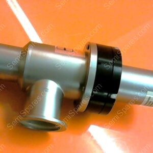 Silver metallic valve-like fitting with a side outlet and a black circular band, lying on an orange surface.