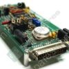 Close-up of a green printed circuit board with a row of metal terminal connectors, resistors, capacitors, and a round battery holder visible.