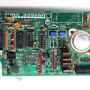Green printed circuit board densely populated with ICs, resistors, capacitors, and an edge connector on the right.