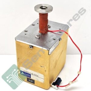 Close-up of a boxy lab device with a red insulated tube and metal top, featuring connectors and a Lam Research label visible on the side.