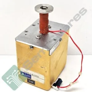 Close-up of a boxy lab device with a red insulated tube and metal top, featuring connectors and a Lam Research label visible on the side.