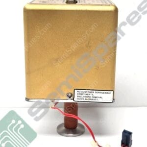 Close-up of a gold metal electronic enclosure with a small terminal on top and a red wire harness exiting the bottom, mounted on a metal stand; warning label on the side states no customer serviceable components.