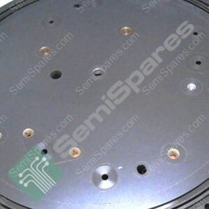 Circular metal mounting plate with multiple holes and threaded inserts; a general machine component.