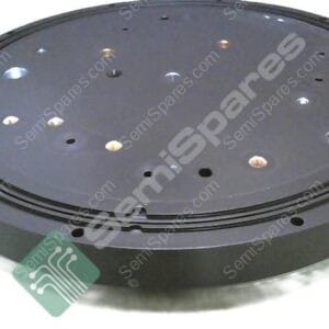 Round black circular spare-part plate with multiple holes and a recessed outer edge, viewed from above.
