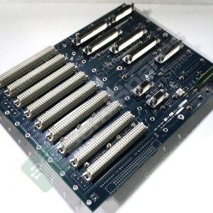 Blue motherboard PCB with multiple long beige PCI/ISA expansion slots and connectors lying on a white surface.