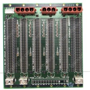 Front/back view of a green PCB with multiple terminal blocks (brown) along the top, and dense rows of pin headers and sockets across the board; power input terminals labeled +5V, GND, -12V, +12V visible at the bottom edge; USB connectors at the bottom corners.