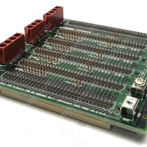 Prototyping circuit board with many header pins and red terminal blocks viewed at an angle