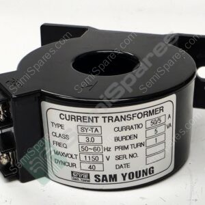 Close-up of a black current transformer with a circular central opening and mounting bracket visible on the side, showing a label with technical specs.