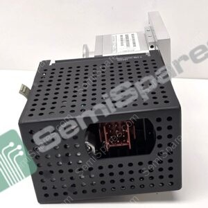 Perforated black metal panel with many circular holes and a small connector block visible behind it, part of an electronic enclosure.