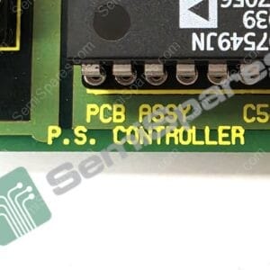 Close-up of a green PCB showing a black module labeled 'PCB ASSY P.S. CONTROLLER' with a row of metal terminal pins beneath it.