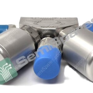 Close-up of a metal pneumatic valve manifold with blue connectors and a green circuit-tag sticking out.