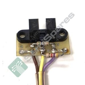 Close-up of a small circuit board with solder joints and a black plastic connector, wires in yellow, purple, and brown attached